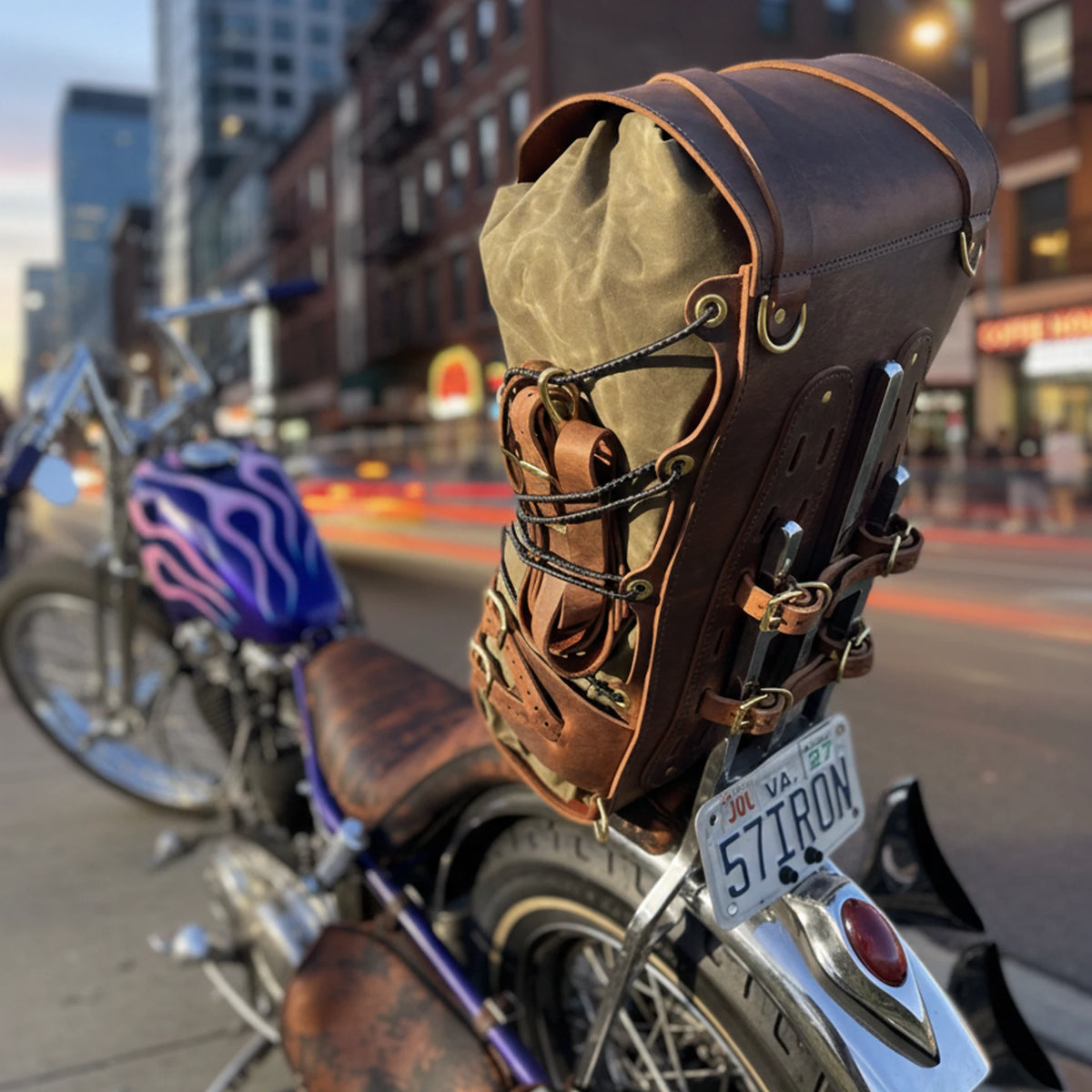 Motorcycle with a leather saddlebag on a city street