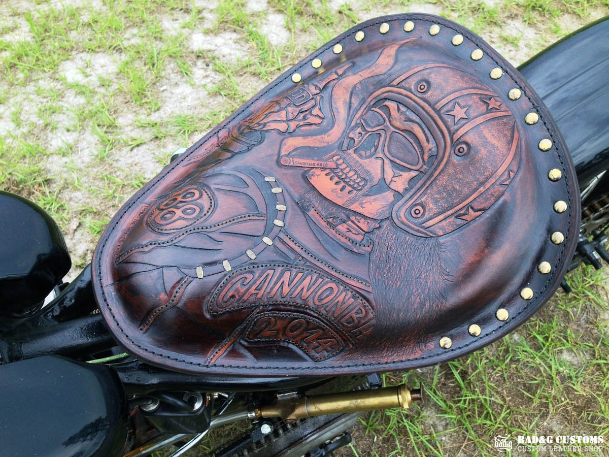 We’re proud to showcase a custom-made seat and saddlebags set crafted specifically for Doug Wothke, the legendary round-the-world motorcycle traveler. Made from hand-tooled and antiqued veg-tan leather, this set took countless hours of expert craftsmanship to complete. Designed for both durability and vintage authenticity, it will accompany him on the 2014 Cannonball Motorcycle Race, as he tackles this grueling challenge aboard his classic Harley-Davidson JD motorcycle. A true tribute to adventure!