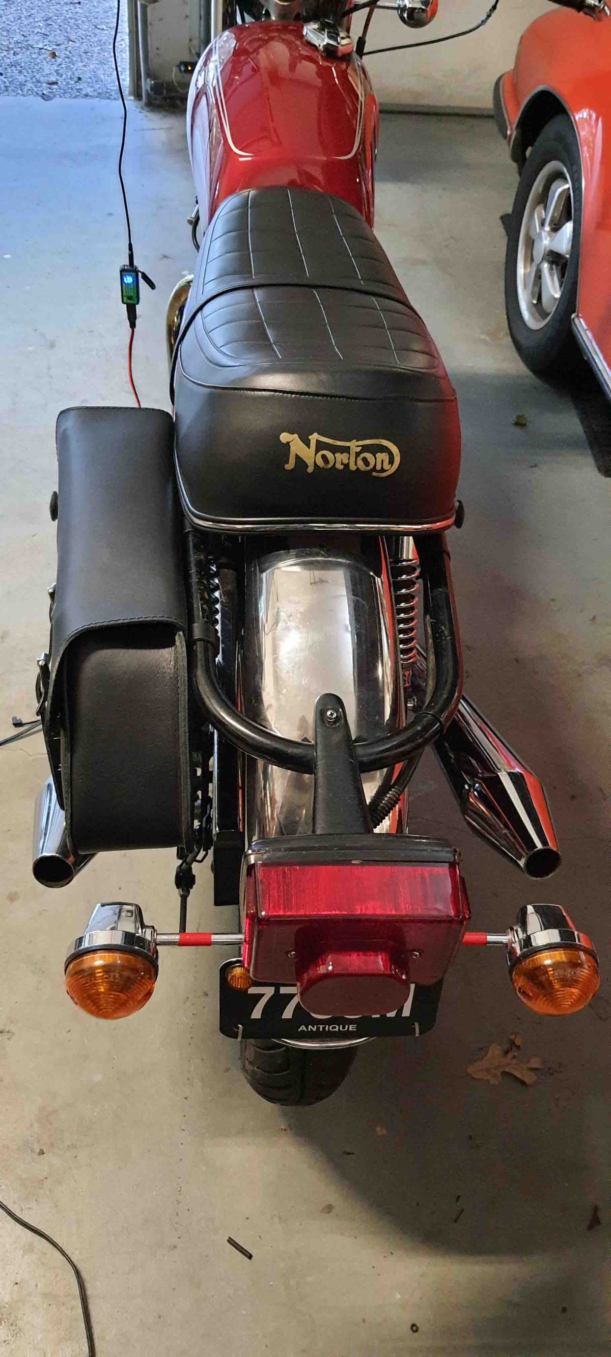 Norton Commando 850 classic motorcycle with vintage design and premium custom leather saddlebags for a perfect fit and timeless style.