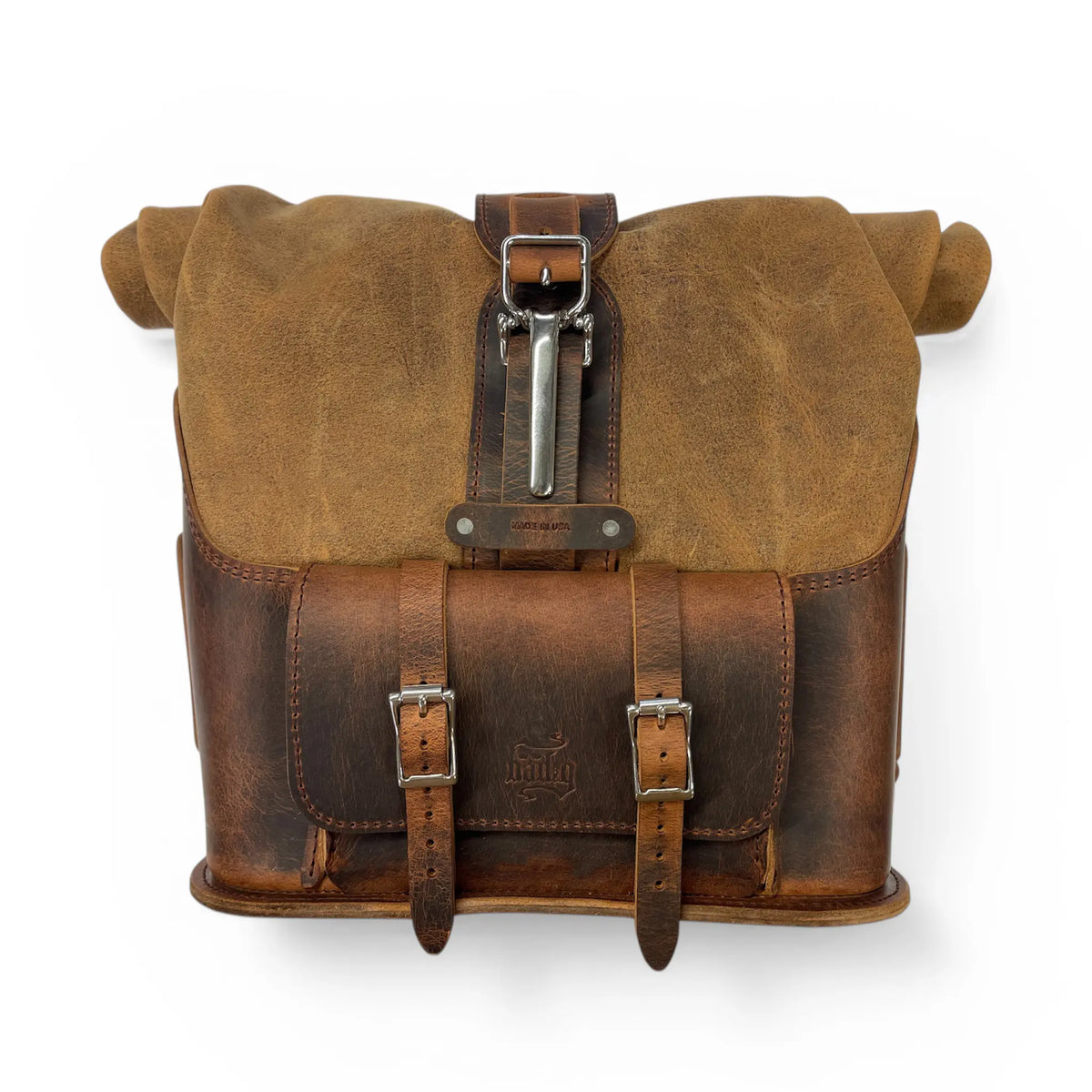 Brown leather satchel bag with a buckle on a white background